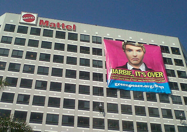 Signs hung on Mattel building in El Segundo by Greenpeace protesting Barbie and Ken