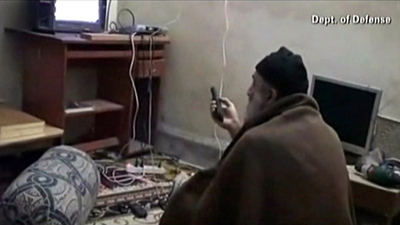 Osama bin Laden watching TV. 
         The American commandos that murdered Osama stole this video when they raided his home